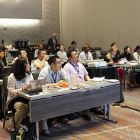 Workshop participants work through a tutorial session with a presenting mentor.