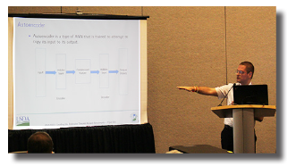 Sartore emphasizing a point at a presentation at JSM 2018