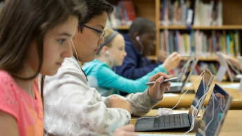 Students taking digitally based assessments. Students taking digitally based assessments.
