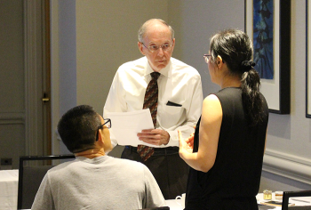 Workshop organizer and mentor Keith Crank speaking with participants.