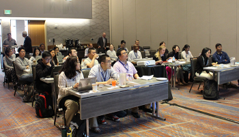 Workshop participants work through a tutorial session with a presenting mentor.