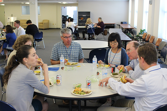 Discussion continues over lunch